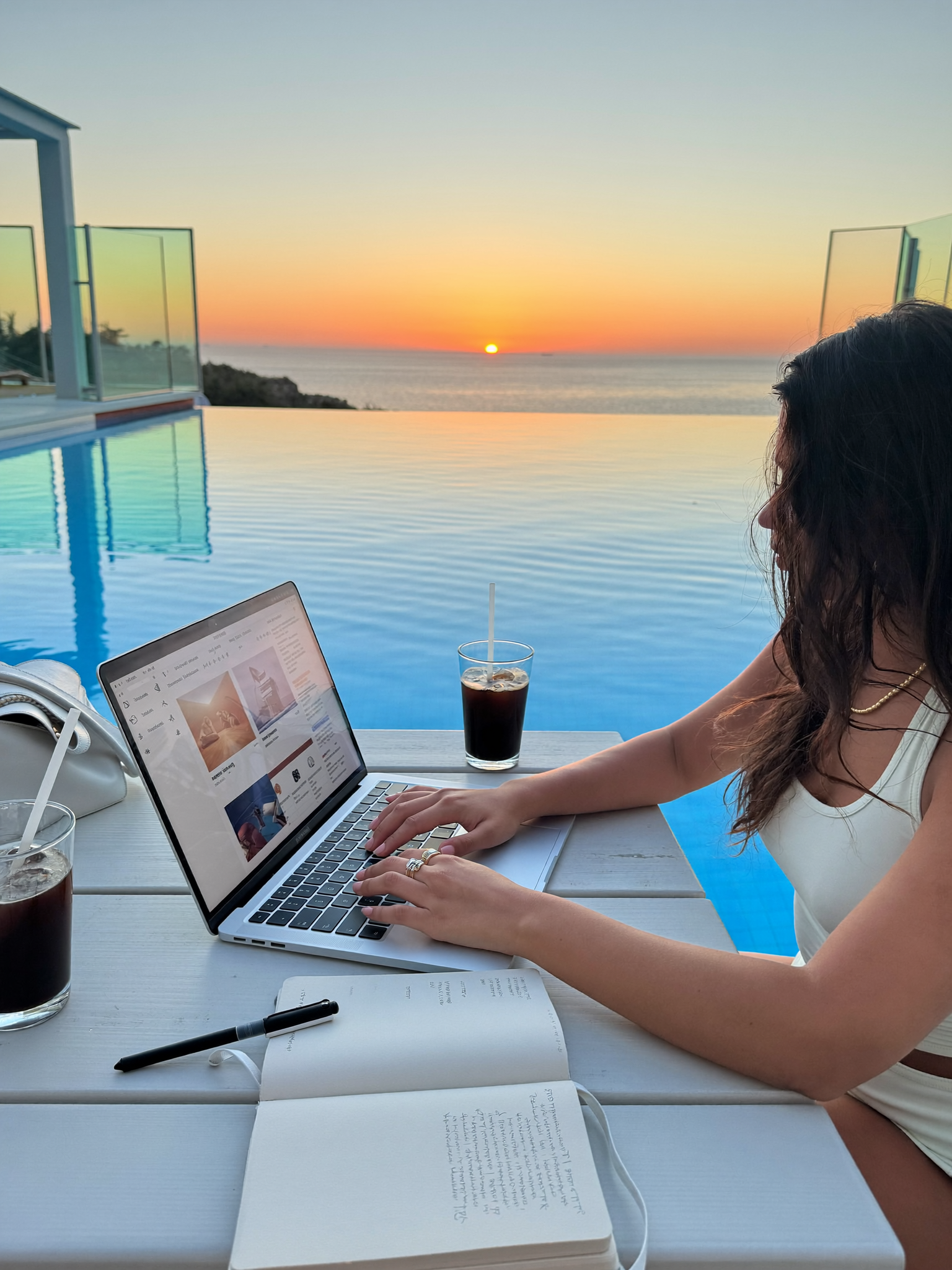 A creator editing content poolside in Miami at golden hour